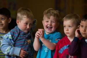 Early years children laughing